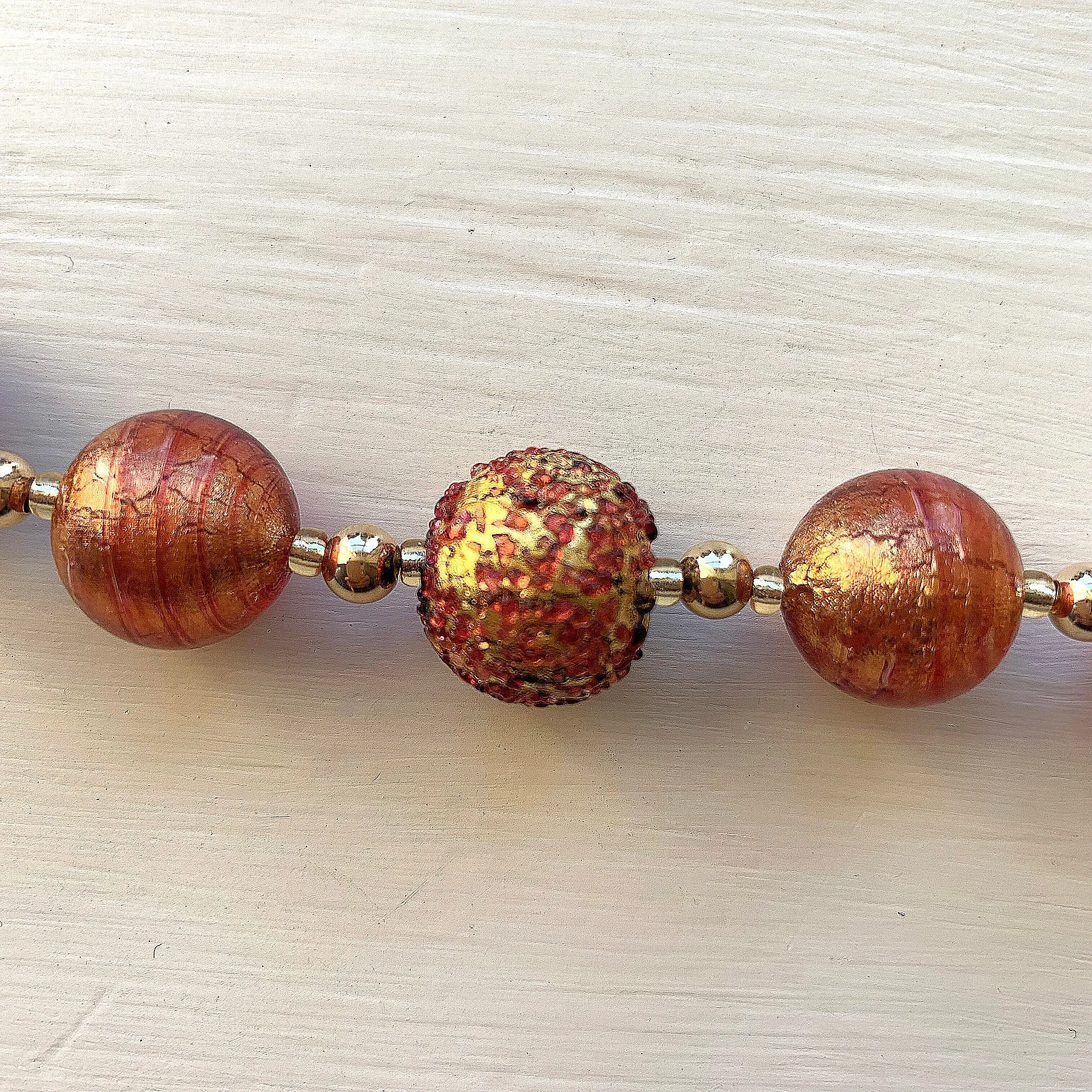 Necklace with speckled burnt orange (rose pink) Murano glass sphere beads on gold